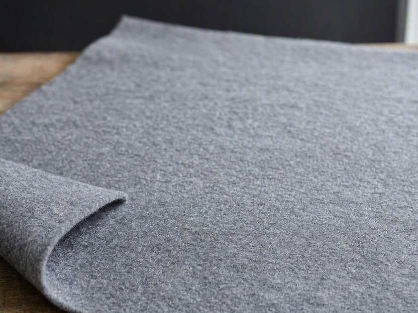 A mid-weight non-woven felt sheet on a workbench